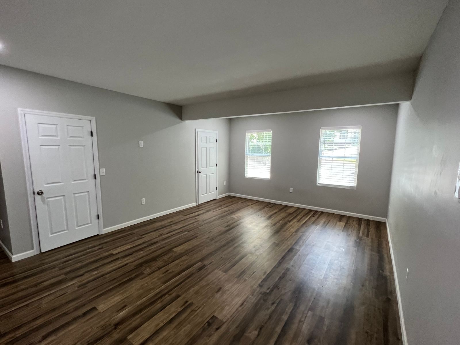 Rental unit with new dark LVP flooring, turnover ready