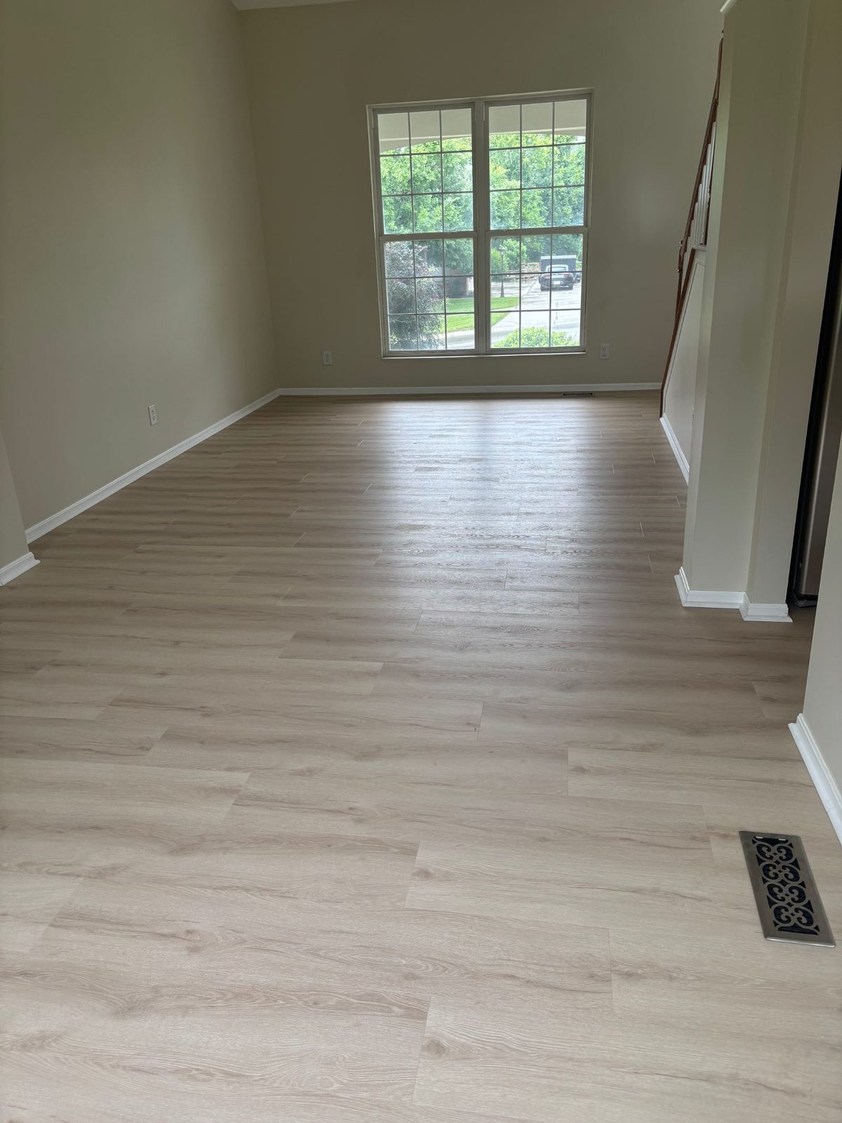 Finished LVP install with clean baseboards and tight seams