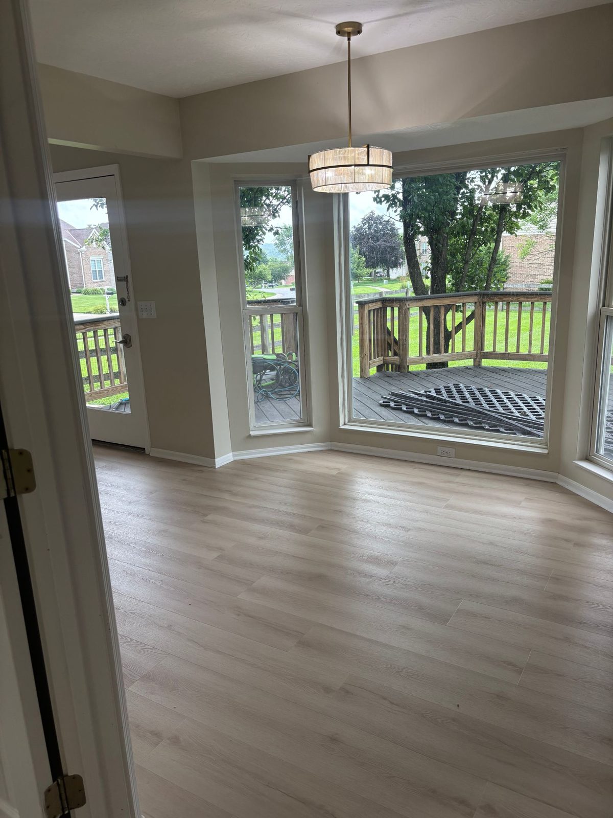 Light blonde LVP with walkout deck view